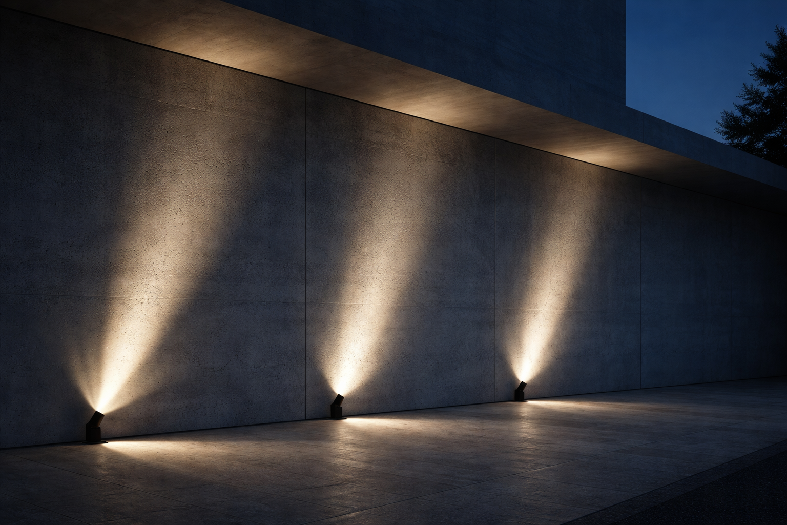 Spotlights illuminating a concrete wall with controlled directional beams highlighting architectural texture