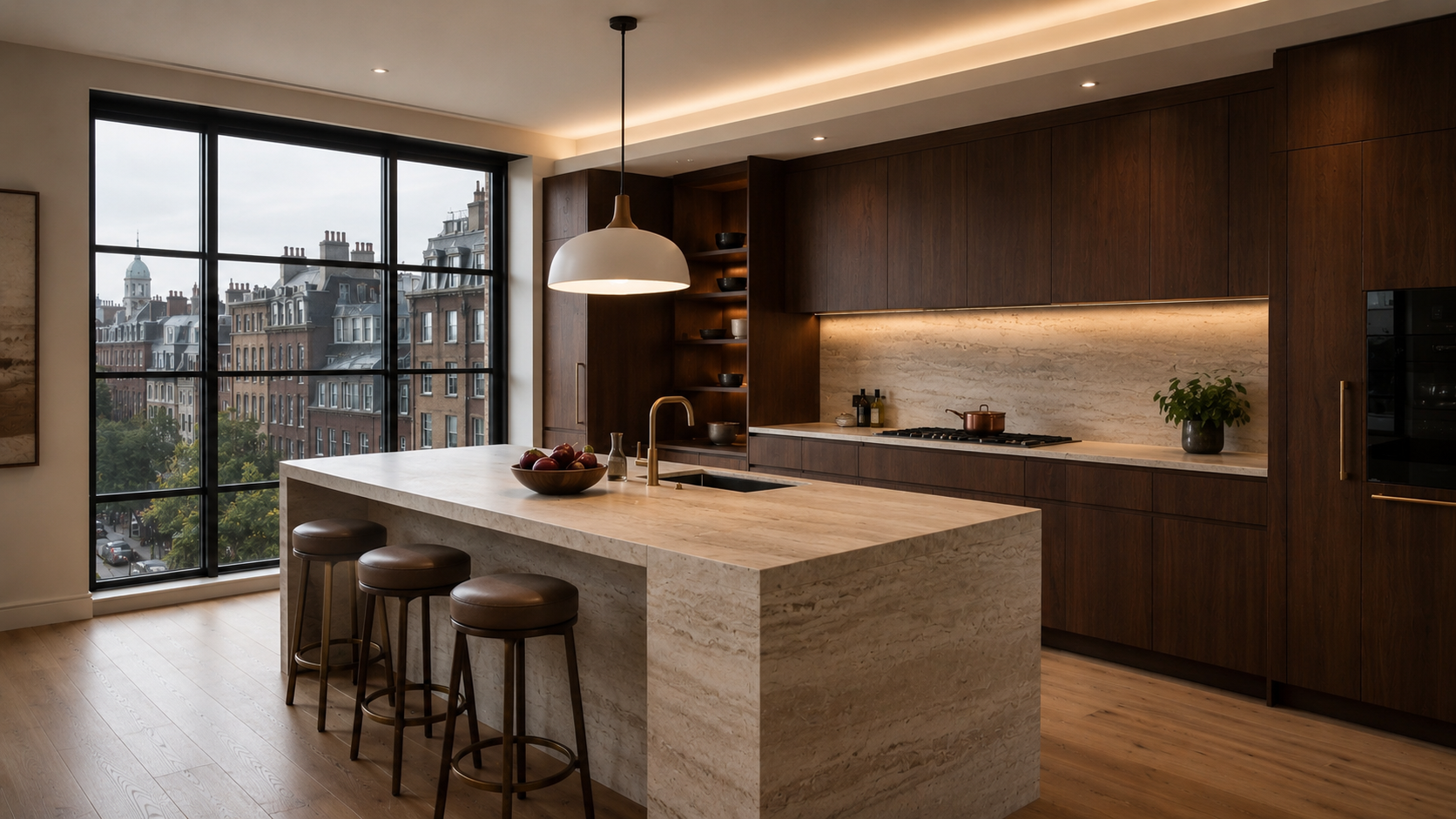 Contemporary kitchen demonstrating effective lighting layout with a single pendant above a stone island, warm under-cabinet lighting, recessed downlights and subtle ceiling cove lighting.