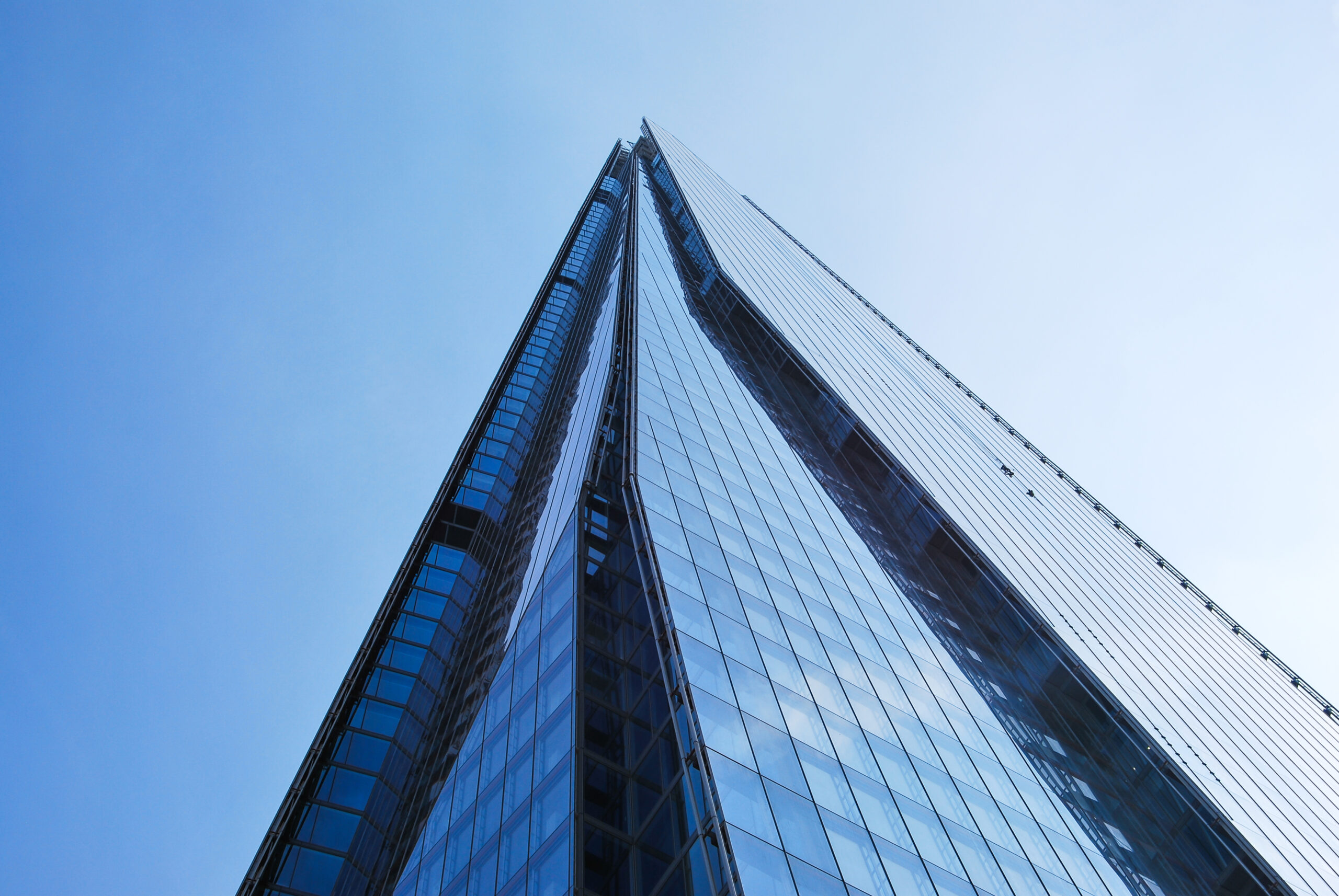 The Shard’s reflective glass façade viewed from below in London
