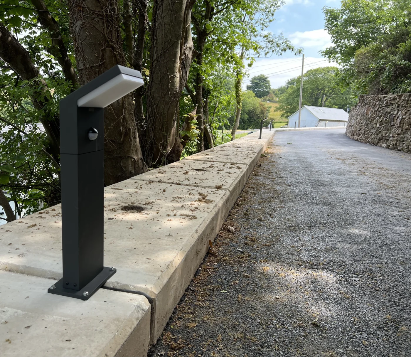 Outdoor bollard lighting along driveway