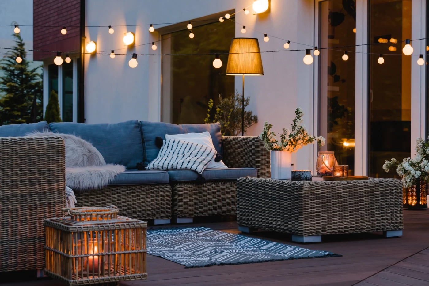 Outdoor seating area with string and ambient lighting