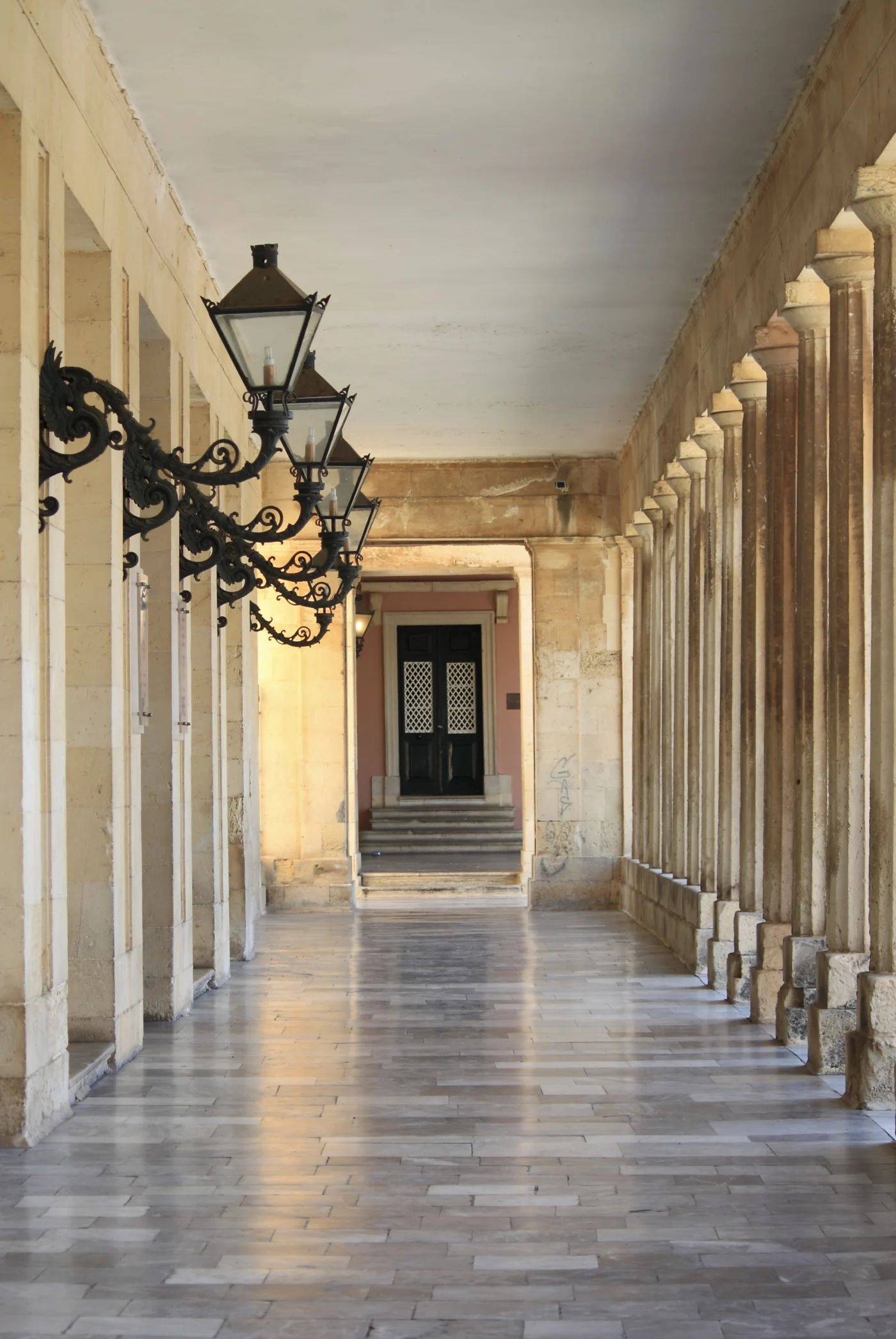 Historic colonnade with decorative wall lanterns